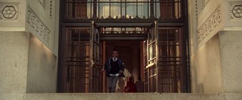 Movie still from “National Treasure” (2004), directed by Jon Turteltaub – A man and a woman walking up the stairs of a building; Wide shot, Low angle