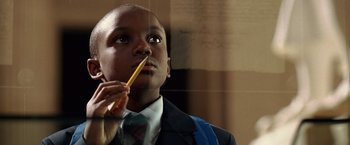 Movie still from “National Treasure” (2004), directed by Jon Turteltaub – A young man holding a pencil in his mouth; Close Up shot, Low angle