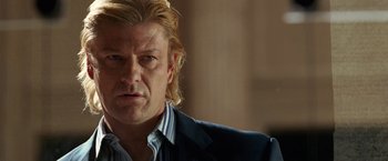 Movie still from “National Treasure” (2004), directed by Jon Turteltaub – A person wearing a suit and tie; Close Up shot, Over the shoulder angle