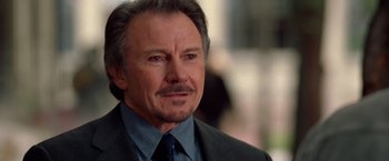 Movie still from “National Treasure” (2004), directed by Jon Turteltaub – An older man in a suit and tie; Close Up shot, Over the shoulder angle