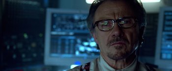 Movie still from “National Treasure” (2004), directed by Jon Turteltaub – A person wearing glasses; Close Up shot, Low angle