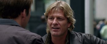 Movie still from “National Treasure” (2004), directed by Jon Turteltaub – A person with long blonde hair; Close Up shot, Over the shoulder angle