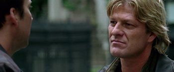 Movie still from “National Treasure” (2004), directed by Jon Turteltaub – A man's face in a brown jacket; Close Up shot, Over the shoulder angle