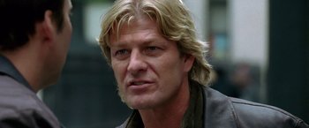 Movie still from “National Treasure” (2004), directed by Jon Turteltaub – A person with long blonde hair; Close Up shot, Low angle