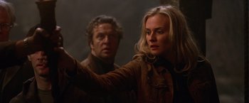 Movie still from “National Treasure” (2004), directed by Jon Turteltaub – A man and a woman standing next to each other; Close Up shot, Low angle