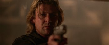 Movie still from “National Treasure” (2004), directed by Jon Turteltaub – A person holding a gun; Close Up shot, Low angle