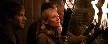 Movie still from “National Treasure” (2004), directed by Jon Turteltaub – A man and a woman looking at something in the dark; Close Up shot, Over the shoulder angle