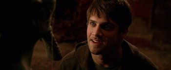 Movie still from “National Treasure” (2004), directed by Jon Turteltaub – A person smiling for the camera; Close Up shot, Over the shoulder angle