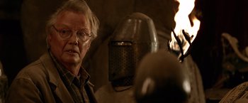 Movie still from “National Treasure” (2004), directed by Jon Turteltaub – An older man wearing glasses and a helmet; Close Up shot, Over the shoulder angle