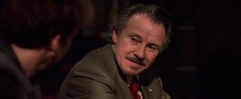 Movie still from “National Treasure” (2004), directed by Jon Turteltaub – A person wearing a suit and tie; Close Up shot, Over the shoulder angle