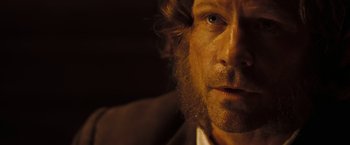 Movie still from “National Treasure: Book of Secrets” (2007), directed by Jon Turteltaub – A person with a beard; Close Up shot, Over the shoulder angle