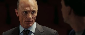 Movie still from “National Treasure: Book of Secrets” (2007), directed by Jon Turteltaub – An older man wearing a suit and tie; Close Up shot, Low angle