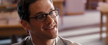 Movie still from “National Treasure: Book of Secrets” (2007), directed by Jon Turteltaub – A person wearing glasses; Close Up shot, Over the shoulder angle