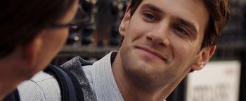 Movie still from “National Treasure: Book of Secrets” (2007), directed by Jon Turteltaub – A man smiling for the camera; Close Up shot, Over the shoulder angle