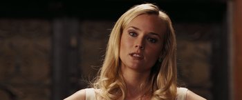 Movie still from “National Treasure: Book of Secrets” (2007), directed by Jon Turteltaub – A woman with blonde hair is looking at the camera; Close Up shot, Over the shoulder angle