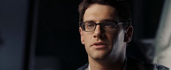 Movie still from “National Treasure: Book of Secrets” (2007), directed by Jon Turteltaub – A person wearing glasses; Close Up shot, Low angle