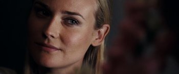 Movie still from “National Treasure: Book of Secrets” (2007), directed by Jon Turteltaub – A woman's face with a lot of makeup on; Extreme Close Up shot, Over the shoulder angle