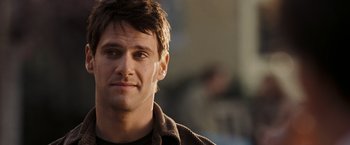 Movie still from “National Treasure: Book of Secrets” (2007), directed by Jon Turteltaub – A man's face in a brown shirt; Close Up shot, Over the shoulder angle