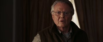 Movie still from “National Treasure: Book of Secrets” (2007), directed by Jon Turteltaub – An older man with glasses and a beard; Close Up shot, Over the shoulder angle