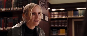 Movie still from “National Treasure: Book of Secrets” (2007), directed by Jon Turteltaub – A beautiful blonde haired woman in a library; Close Up shot, Over the shoulder angle