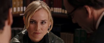 Movie still from “National Treasure: Book of Secrets” (2007), directed by Jon Turteltaub – A person wearing a black jacket; Close Up shot, Over the shoulder angle