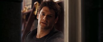 Movie still from “National Treasure: Book of Secrets” (2007), directed by Jon Turteltaub – A person wearing a black shirt; Close Up shot, Over the shoulder angle