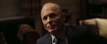 Movie still from “National Treasure: Book of Secrets” (2007), directed by Jon Turteltaub – An older man wearing a suit and tie; Close Up shot, Low angle