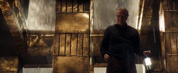 Movie still from “National Treasure: Book of Secrets” (2007), directed by Jon Turteltaub – An older man standing in front of a wall; Medium shot, Low angle
