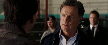 Movie still from “National Treasure: Book of Secrets” (2007), directed by Jon Turteltaub – A person wearing a jacket; Close Up shot, Over the shoulder angle