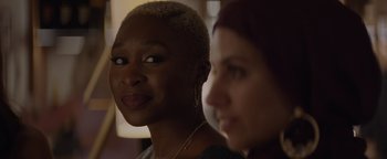 Movie still from “Needle in a Timestack” (2021), directed by John Ridley – Two people with short hair; Close Up shot, Over the shoulder angle