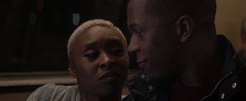 Movie still from “Needle in a Timestack” (2021), directed by John Ridley – Two people looking at one another; Close Up shot, Over the shoulder angle