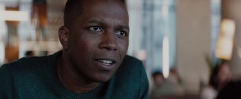 Movie still from “Needle in a Timestack” (2021), directed by John Ridley – A man's face , looking into the distance; Close Up shot, Over the shoulder angle