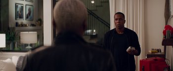 Movie still from “Needle in a Timestack” (2021), directed by John Ridley – A man standing in front of a bathroom mirror; Medium shot, Over the shoulder angle