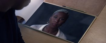 Movie still from “Needle in a Timestack” (2021), directed by John Ridley – A reflection of a woman in a mirror; Close Up shot, High angle