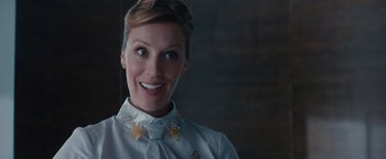 Movie still from “Needle in a Timestack” (2021), directed by John Ridley – A woman wearing a white shirt and a bow tie; Close Up shot, Over the shoulder angle