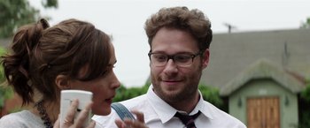 Movie still from “Neighbors” (2014), directed by Nicholas Stoller – A man and a woman talking to each other outside; Close Up shot, Over the shoulder angle