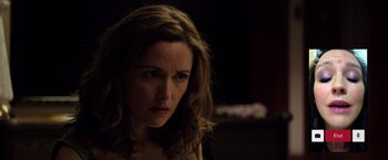 Movie still from “Neighbors” (2014), directed by Nicholas Stoller – A person with long brown hair; Close Up shot, Over the shoulder angle