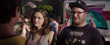 Movie still from “Neighbors” (2014), directed by Nicholas Stoller – A man and a woman standing next to each other on the street; Close Up shot, Over the shoulder angle