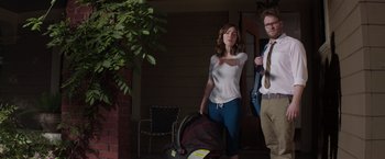 Movie still from “Neighbors” (2014), directed by Nicholas Stoller – A man and a woman walking with a baby in a stroller; Medium shot, Over the shoulder angle