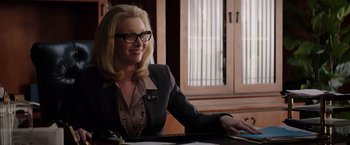 Movie still from “Neighbors” (2014), directed by Nicholas Stoller – A woman sitting at a table with a laptop; Close Up shot, Over the shoulder angle