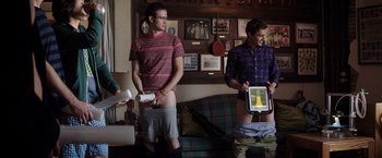 Movie still from “Neighbors” (2014), directed by Nicholas Stoller – Two men are playing a video game together; Medium shot, Low angle
