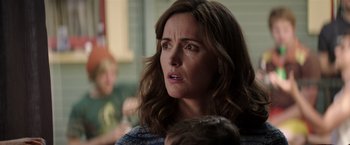 Movie still from “Neighbors” (2014), directed by Nicholas Stoller – A person with her eyes wide open; Close Up shot, Over the shoulder angle