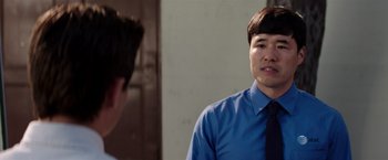 Movie still from “Neighbors” (2014), directed by Nicholas Stoller – A man in a blue dress shirt and a tie; Close Up shot, Over the shoulder angle