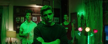 Movie still from “Neighbors” (2014), directed by Nicholas Stoller – A group of young men standing next to each other in a room; Medium shot, Low angle