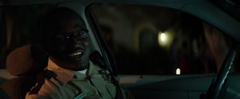 Movie still from “Neighbors” (2014), directed by Nicholas Stoller – A man sitting in the drivers seat of a car at night; Close Up shot, Over the shoulder angle