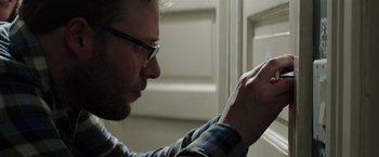 Movie still from “Neighbors” (2014), directed by Nicholas Stoller – A person using a cell phone; Close Up shot, Over the shoulder angle