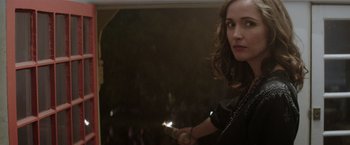Movie still from “Neighbors” (2014), directed by Nicholas Stoller – A woman is holding a sparkler in her hand; Close Up shot, Over the shoulder angle