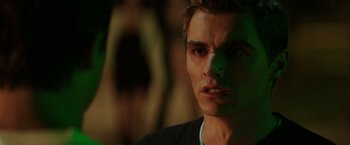 Movie still from “Neighbors” (2014), directed by Nicholas Stoller – A man's face in the dark; Close Up shot, Over the shoulder angle