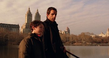Movie still from “Night at the Museum” (2006), directed by Shawn Levy – A man standing next to a young boy holding a stick; Medium shot, Over the shoulder angle