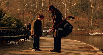 Movie still from “Night at the Museum” (2006), directed by Shawn Levy – A man and a boy with a hockey stick and a bag; Medium shot, Over the shoulder angle